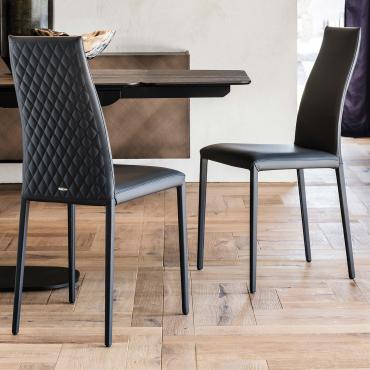 Kay is a chair with tall quilted curved back by Cattelan