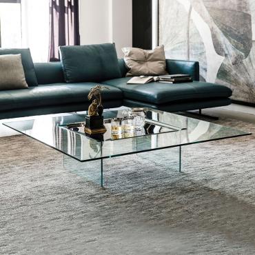 Carrè is a glass coffee table with metal tray by Cattelan that is useful set in front of the sofa 
