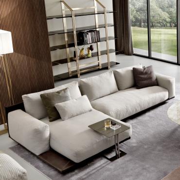 Victor modern luxury sofa with structure covered in leather and cushions in fabric