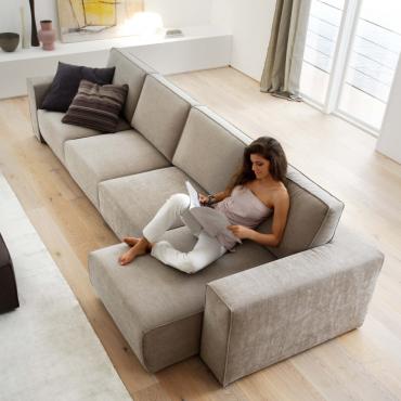 Attitude is a sofa with pull-out seat that becomes a chaise longue