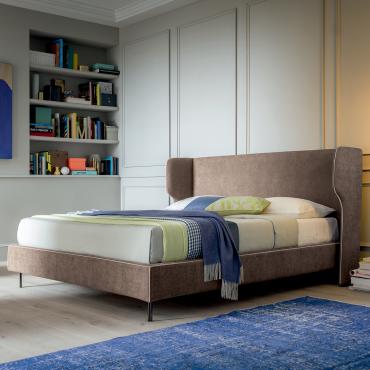 Grevy bed with built-in storage and curved headboard