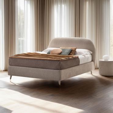 Upholstered bed with curved headboard Antilla