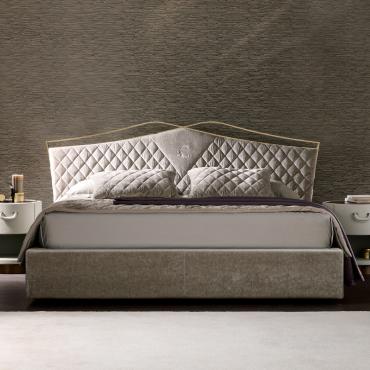 Valentino bed with velvet quilted headboard by Cantori