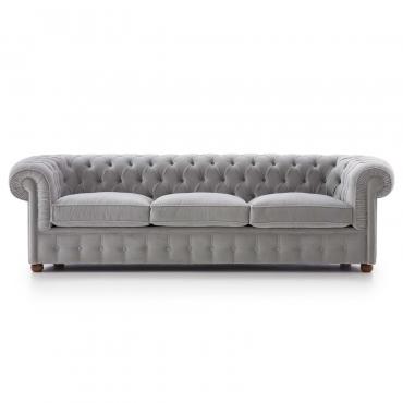 Chester is a classic leather Chesterfield sofa with tufted pattern and curly armrestso