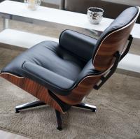 The Eames armchair, a replica inspired by Charles Eames’ design, is available in either wood or leather