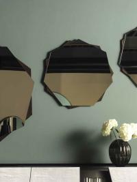 Medea shaped mirror with metal frame by Cantori used as an arrangement in different sizes