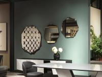 Medea shaped mirror with metal frame by Cantori used to furnish an elegant living room
