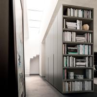Wide end side bookcase is an original element to complete the hinged door wardrobes 