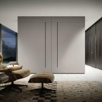 Blace coplanar sliding wardrobe with symmetric flush doors. Platinum finish available also in a 2 colour version with panel doors in another shade