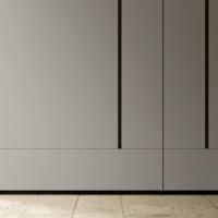 Blace coplanar sliding wardrobe with symmetric flush doors. Matt or glossy lacquer finish, also in a two colour version