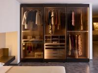 Boutique wardrobe with transparent glass sliding doors - the interior and fittings are in nude matte lacquer, an added bonus to the collection