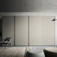 Sound is a minimal lacquered sliding wardrobe with built-in handle