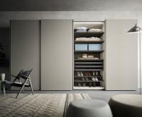 Sound is a minimal lacquered sliding wardrobe with 4 doors
