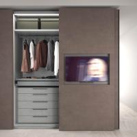 Sliding door wardrobe with central door with TV unit