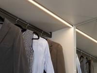 Detail of clothes hanging rod and LED lighting