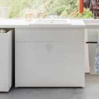 Wide laundry sink cabinet with basket on casters