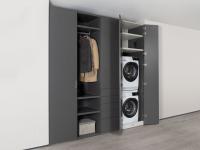 Wide hinged wardrobe with open element and laundry column with washing machine and dryer compartment