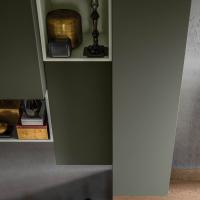 Pleasant chromatic contrast of the wall units in Pine matt lacquer and open boxes in Green Tea matt lacquered