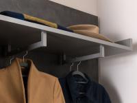Detail of the rails for clothes placed perpendicularly on the shelf