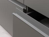 Detail of the lacquered horizontal recess grip of the drawers