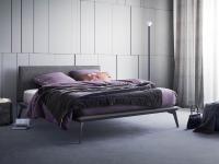 Lacrosse bed with fabric-upholstered headboard. Gun metal lacquered bed frame 