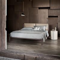 Skinny minimalist bed with hide leather headboard