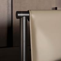 Detail of the stitching on the hide-leather a feature that underline the custom made feature of the bed