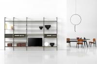 Betis shelving system featuring open compartments with glass shelf and boxes in belting leather
