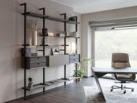 Betis shelving system equipped with trays, wooden and glass shelves, cabinets with drop down doors and belting leather fronts