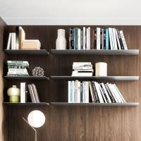 Wide is a modern and practical shelf for wall panels, here pictured the version made of metal