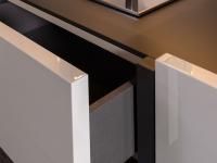 Detail base in glossy lacquered with spacious deep drawer 