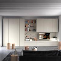 Wide modern living room with wardrobe, wall units and cabinets