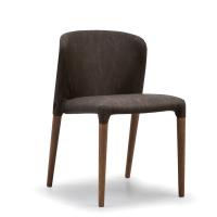 Claire upholstered chair available in the version with visible wooden legs