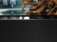 Detail of the top, back lacquered in black on a TV unit Fado