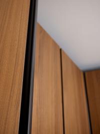 Detail of the full-height recessed grip, a distinguishing feature of the Utah Pacific cabinet