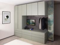 Wide design bridge wardrobe with full-height module on the left and drawers underneath