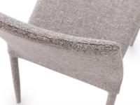 Detail of the high upholstered backrest of the Akira 2.0 chair