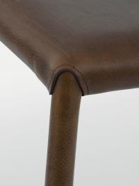 Detail of the connection between the seat and legs of Denali stool