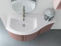 Curved Atlantic bathroom cabinet with Versus washbasin in continuation on curved end unit