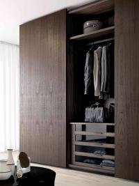 Interior drawers with smoked glass fronts, shelves and hangers for a functional and distinct wardrobe interior