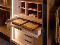 Detail of the drawer with glass front, especially convenient for underwear. Resting on the chest of drawers is the 6-compartment cubby storage per 95.2 cm module