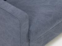 Detail of the armrest  with rounded outline and stonewashed Stone fabric in blue jeans colour