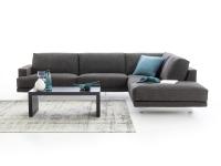 Corner sofa covered in grey fabric and wide meridienne