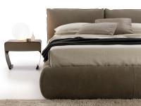 Detail of the comfy and generous shapes of the bed frame and the head cushions