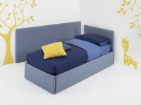 Single bed with upholstered wall panel