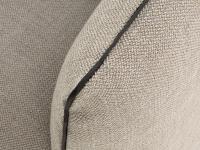 Detail of fabric covering with contrasting faux leather profile