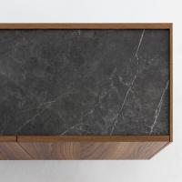 Detail of the fronts in canaletto walnut wood veneer that makes a nice modern contrast with the slate grey matt ceramic stone top