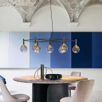 Sofì pendant lamp with 10 glass globes in a modern, sophisticated living room