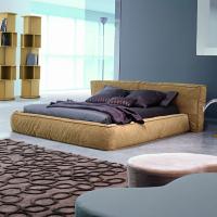 Fluff is a soft, down-padded bed by Bonaldo with painted wood feet