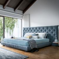 Full Moon quilted bed with large headboard by Bonaldo with an iconic design revisited with a modern approach